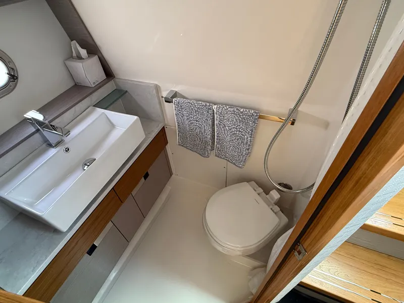 Slide: The Image of Modern bathroom with sink, toilet, and towels on a boat. - 41