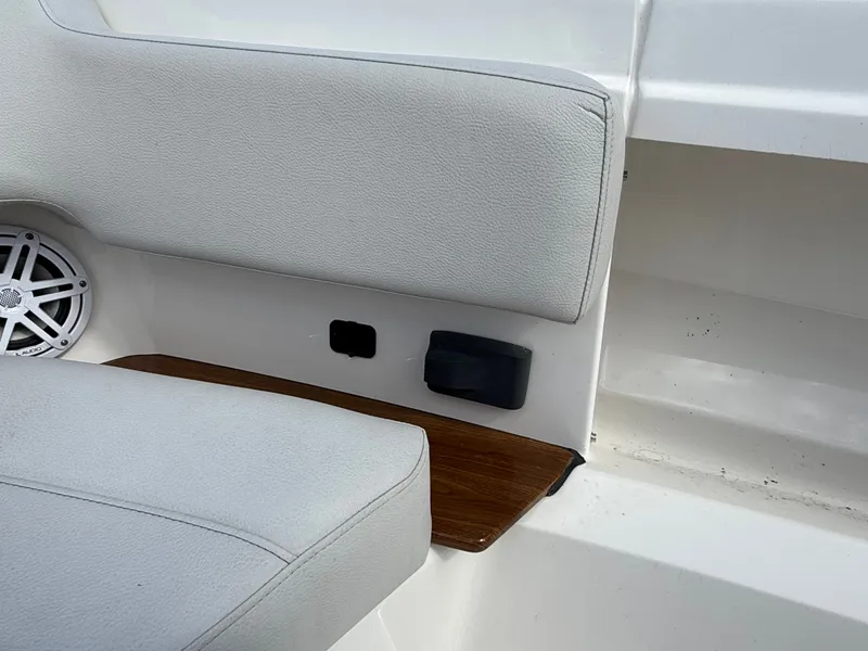 Slide: The Image of Close-up of a seating area with speaker and wood accents on a 2024 Tiara Yachts 38 LS. - 46