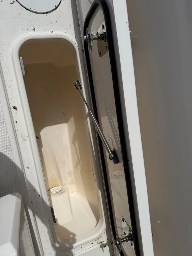 Slide: The Image of Open storage compartment on a 2024 Tiara Yachts 38 LS boat. - 48