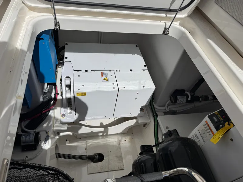 Slide: The Image of Engine compartment of the 2024 Tiara Yachts 38 LS with technical components. - 7