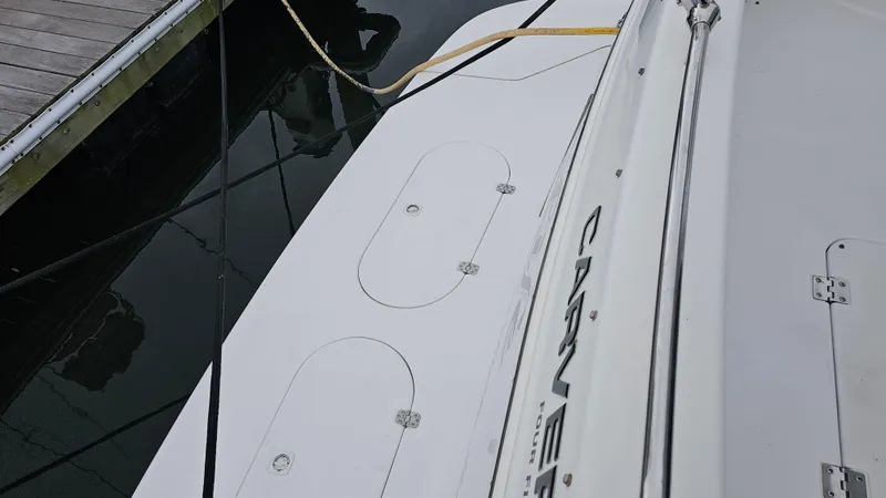 Slide: The Image of Carver 450 Voyager Pilothouse 2000 docked, showing deck details and mooring lines. - 15