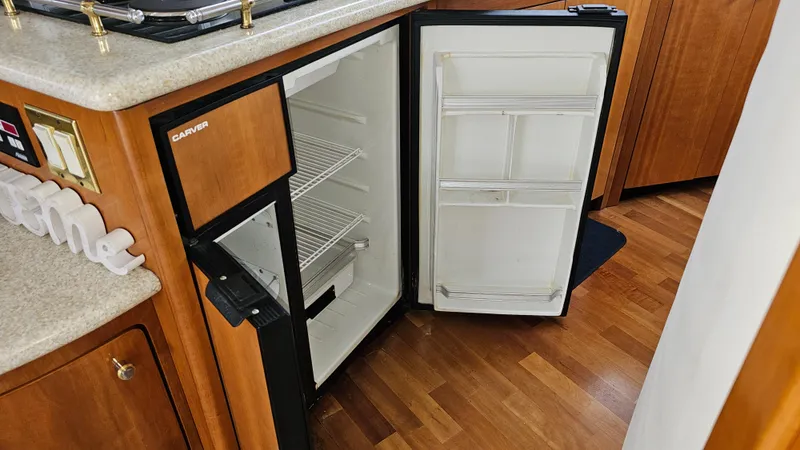Slide: The Image of Open refrigerator in 2000 Carver 450 Voyager Pilothouse yacht kitchen interior. - 33