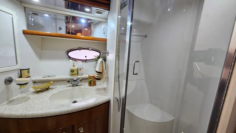 Slide: The Image of Luxurious bathroom in 2000 Carver 450 Voyager Pilothouse yacht with modern amenities. - 49