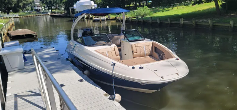 The Image of 2017 Sea Ray SDX 240 Outboard boat docked on a sunny day. - 0