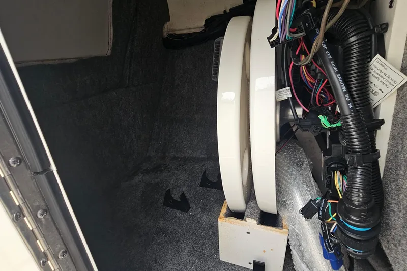 Slide: The Image of 2017 Sea Ray SDX 240 Outboard interior wiring and components detail. - 33