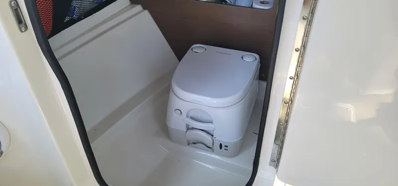 Slide: The Image of Portable toilet inside 2017 Sea Ray SDX 240 Outboard boat cabin. - 7