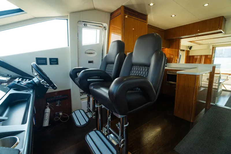 Slide: The Image of Luxurious interior of 2016 Sunseeker Manhattan 65 yacht with leather seating and modern helm. - 19