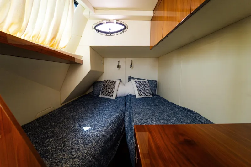 Slide: The Image of Cozy twin cabin in 2016 Sunseeker Manhattan 65 yacht with modern decor. - 50