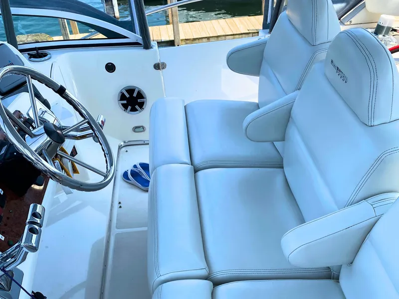 Slide: The Image of Interior of a 2003 Silverton 39 Motor Yacht with white leather seating. - 10