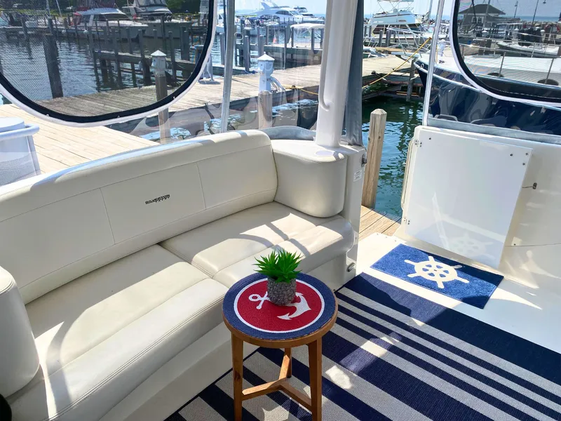 Slide: The Image of Interior of a 2003 Silverton 39 Motor Yacht with white sofa and nautical decor. - 12