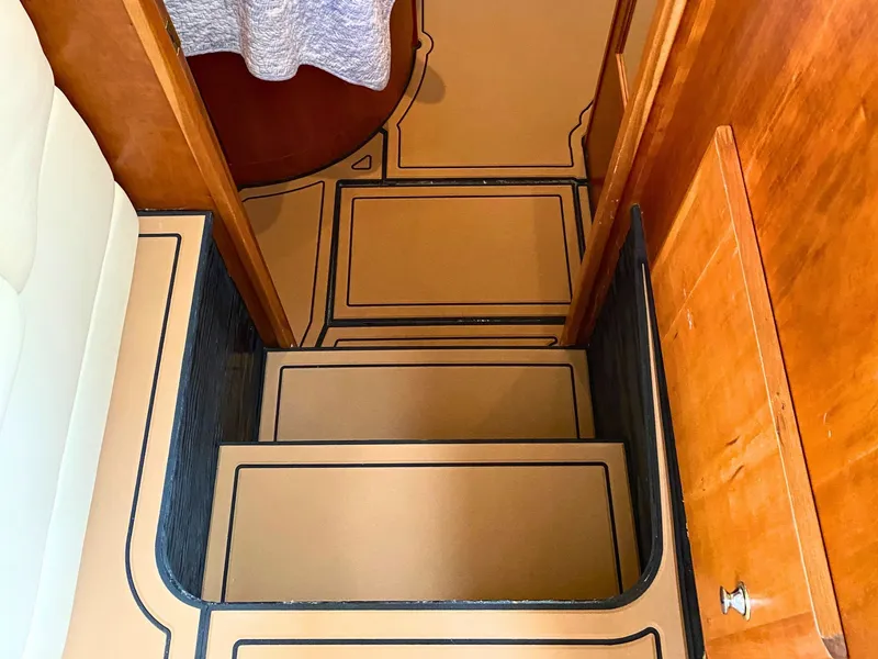 Slide: The Image of Interior of the 2003 Silverton 39 Motor Yacht with stairs and wooden furnishings. - 20
