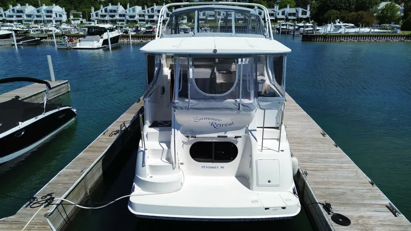 Slide: The Image of 2003 Silverton 39 Motor Yacht docked with surrounding buildings. - 5