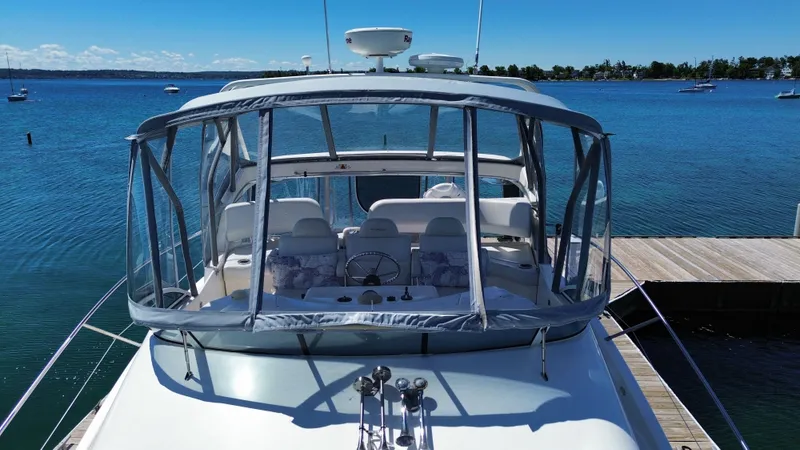 Slide: The Image of 2003 Silverton 39 Motor Yacht docked with clear skies. - 6