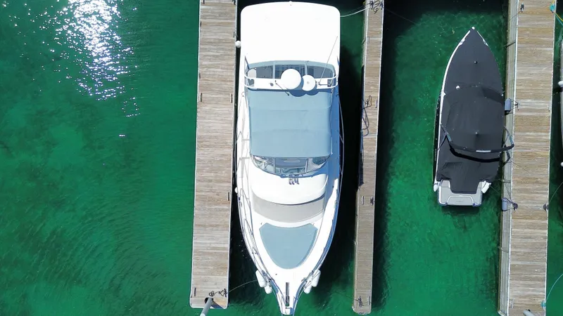 Slide: The Image of Aerial view of a 2003 Silverton 39 Motor Yacht docked in clear water. - 7