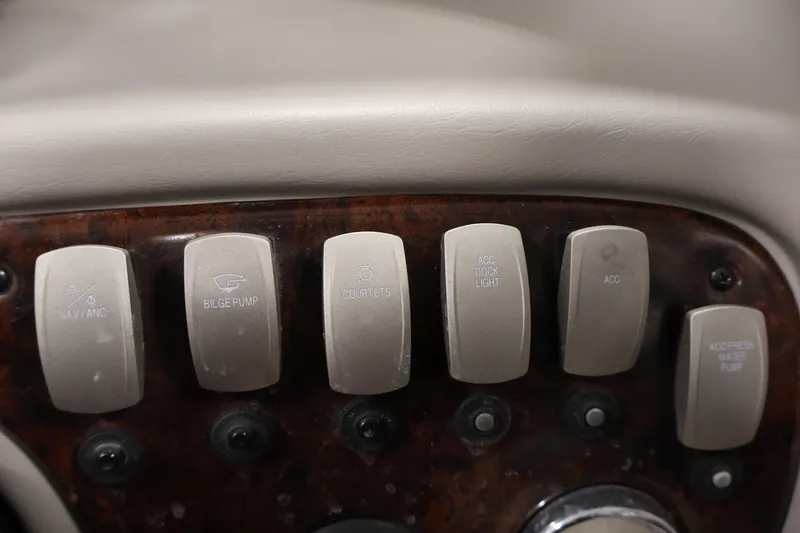 Slide: The Image of Dashboard switches of a 2005 Ebbtide 2300 Sport Cuddy boat. - 20