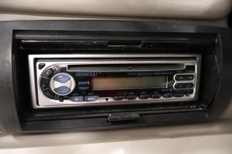 Slide: The Image of Kenwood stereo system in 2005 Ebbtide 2300 Sport Cuddy boat dashboard. - 22