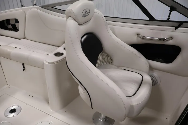Slide: The Image of 2005 Ebbtide 2300 Sport Cuddy interior with white seating and sleek design. - 25
