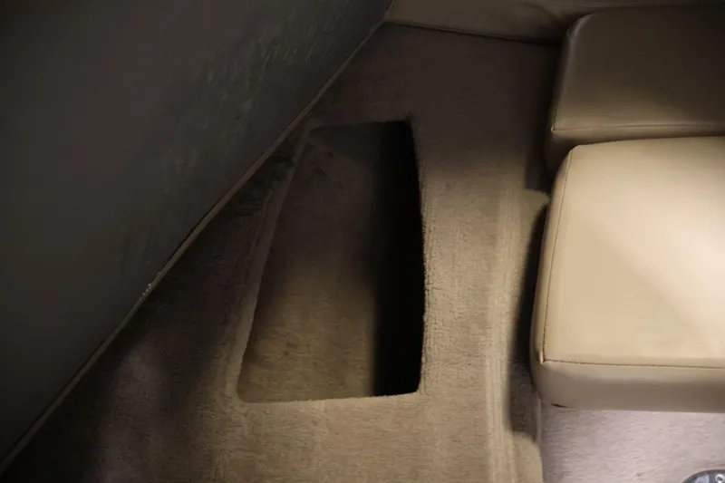 Slide: The Image of Interior of 2005 Ebbtide 2300 Sport Cuddy showing carpeted floor and seating. - 31