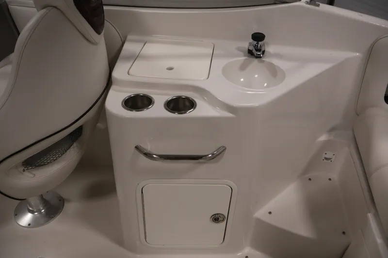Slide: The Image of 2005 Ebbtide 2300 Sport Cuddy interior with sink and cup holders. - 34