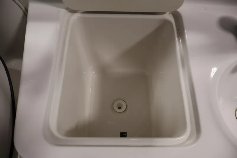 Slide: The Image of White sink basin in 2005 Ebbtide 2300 Sport Cuddy boat interior. - 35