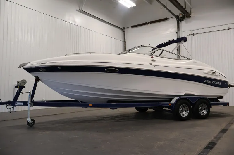 Slide: The Image of 2005 Ebbtide 2300 Sport Cuddy boat on trailer in indoor storage facility. - 46
