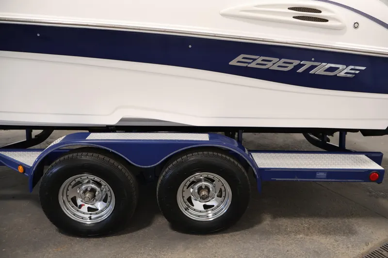 Slide: The Image of 2005 Ebbtide 2300 Sport Cuddy boat on a dual-axle trailer. - 47