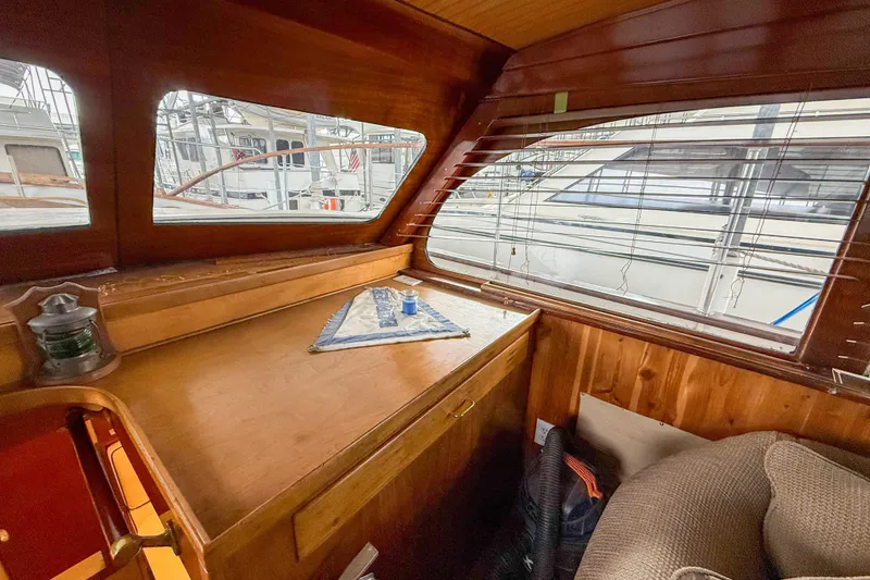 Slide: The Image of 1956 Burger Pilothouse interior with wooden finish and nautical decor. - 31