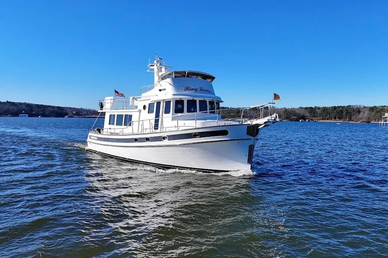 The Image of 2007 Nordic Tug 54 cruising on a sunny day in open waters. - 0