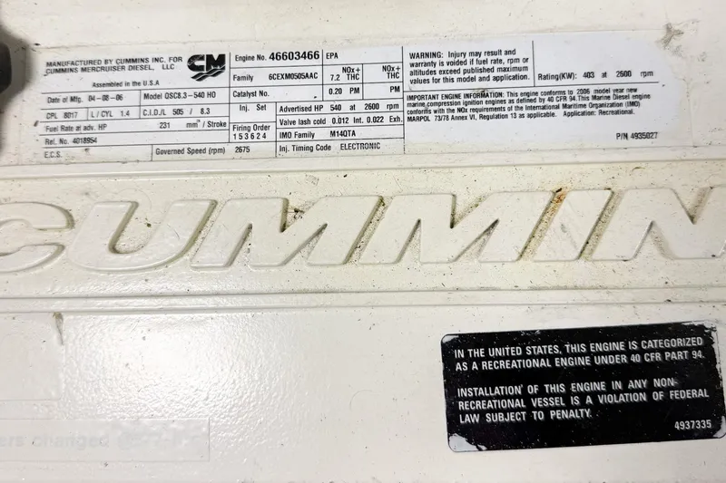 Slide: The Image of Cummins engine label on a 2007 Nordic Tug 54, detailing specifications and warnings. - 42