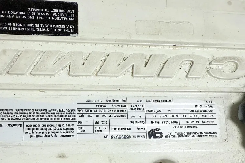 Slide: The Image of Close-up of a Cummins engine label on a 2007 Nordic Tug 54. - 43