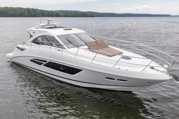 The Image of 2016 Sea Ray Sundancer 510 yacht on calm water, showcasing sleek design and luxury features. - 0