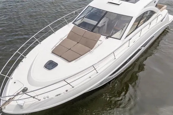 Slide: The Image of 2016 Sea Ray Sundancer 510 yacht with sleek design and spacious deck on calm water. - 17