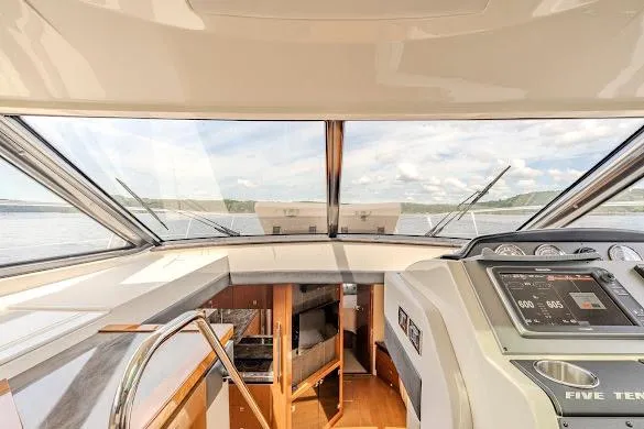 Slide: The Image of Interior view of 2016 Sea Ray Sundancer 510 yacht cockpit with panoramic windows. - 27