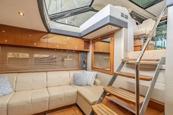 Slide: The Image of Luxurious interior of 2016 Sea Ray Sundancer 510 yacht with plush seating and wooden stairs. - 35