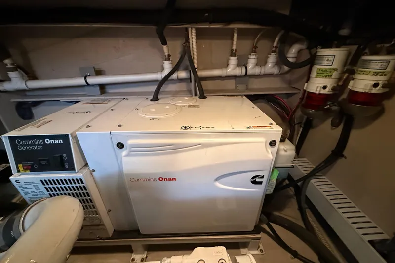 Slide: The Image of Cummins Onan generator in 2016 Sea Ray Sundancer 510 engine room, showcasing marine equipment. - 57