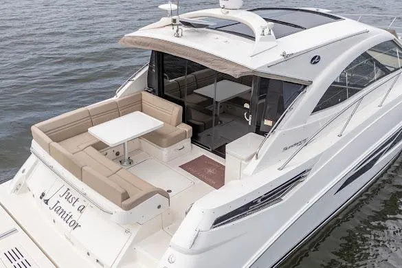 Slide: The Image of 2016 Sea Ray Sundancer 510 yacht with spacious deck and seating on the water. - 8