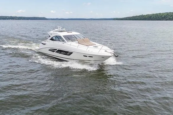 Slide: The Image of 2016 Sea Ray Sundancer 510 cruising on a calm lake under a clear sky. - 9