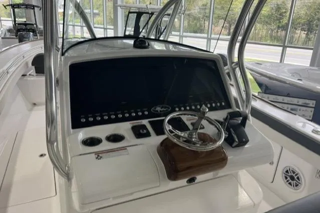Slide: The Image of 2022 Valhalla Boatworks V-33 helm with modern controls and steering wheel. - 3