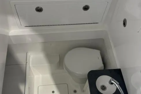 Slide: The Image of 2022 Valhalla Boatworks V-33 interior with toilet and sink. - 16