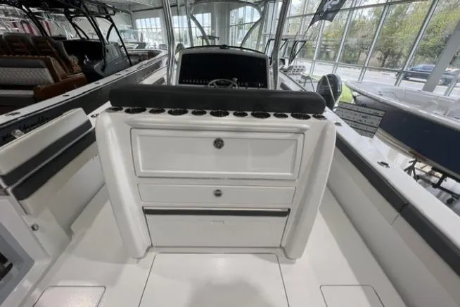 Slide: The Image of 2022 Valhalla Boatworks V-33 interior with storage compartments and rod holders. - 13
