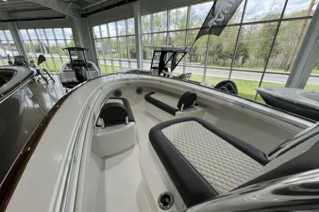 Slide: The Image of 2022 Valhalla Boatworks V-33 interior with sleek seating and modern design in showroom. - 8
