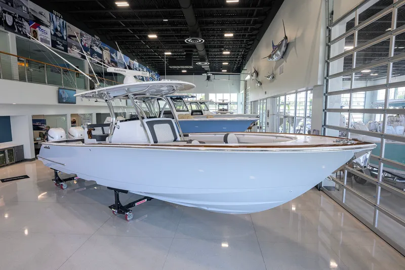 Slide: The Image of 2023 Valhalla Boatworks V-33 displayed in a modern showroom setting. - 3