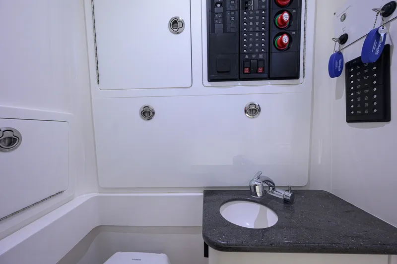 Slide: The Image of 2023 Valhalla V-33 boat interior with control panel and sink. - 42
