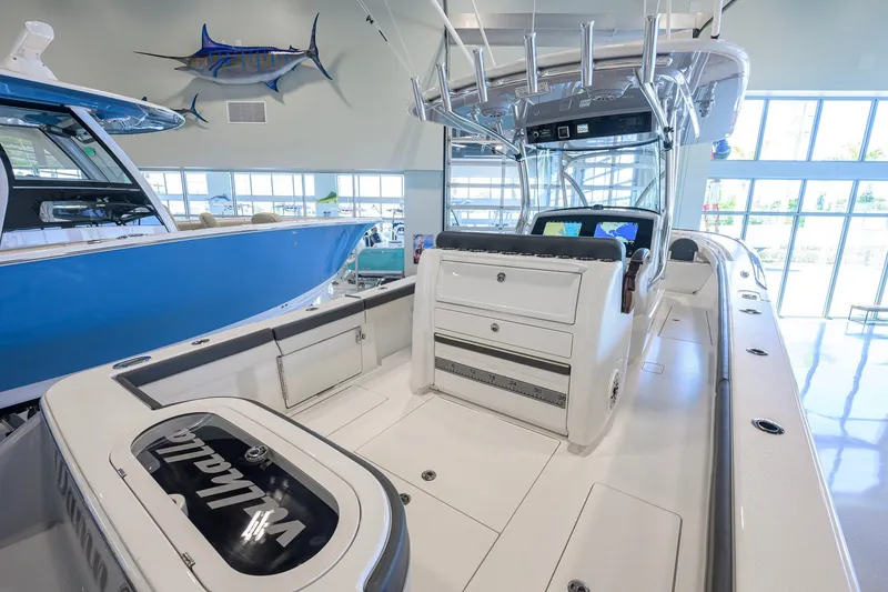 Slide: The Image of 2023 Valhalla Boatworks V-33 interior with fishing rod holders and navigation screens. - 32