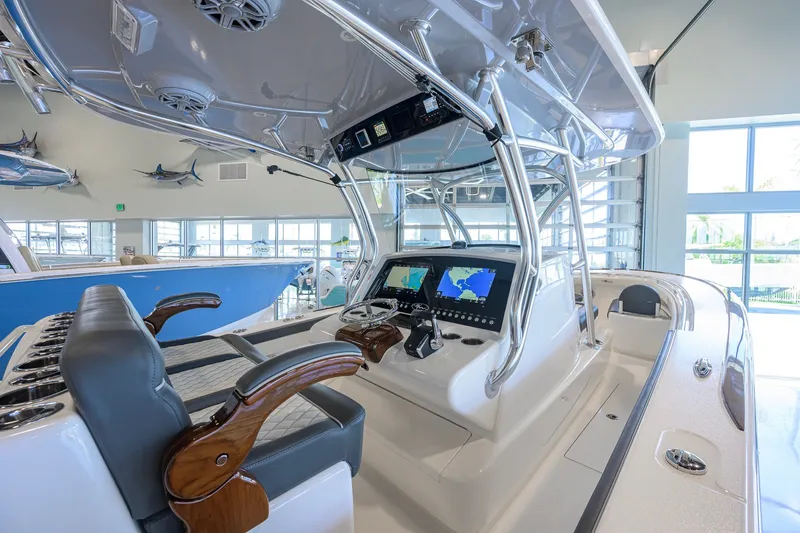 Slide: The Image of 2023 Valhalla Boatworks V-33 interior with advanced navigation system and luxurious seating. - 25