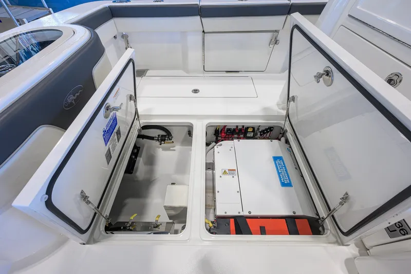Slide: The Image of 2023 Valhalla Boatworks V-33 storage compartments with open hatches, showcasing interior equipment. - 52
