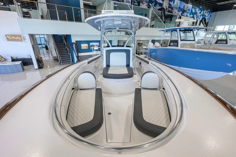 Slide: The Image of 2023 Valhalla Boatworks V-33 interior with luxurious seating in showroom. - 20