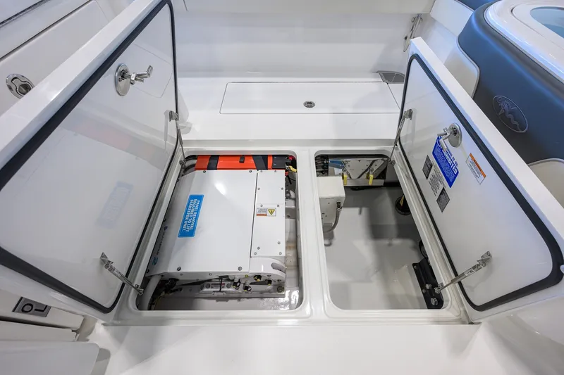 Slide: The Image of 2023 Valhalla Boatworks V-33 engine compartment with open hatches, showcasing internal components. - 50