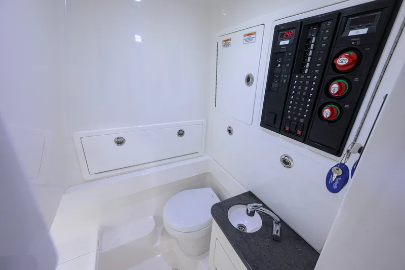 Slide: The Image of 2023 Valhalla Boatworks V-33 interior with control panel, sink, and toilet. - 41