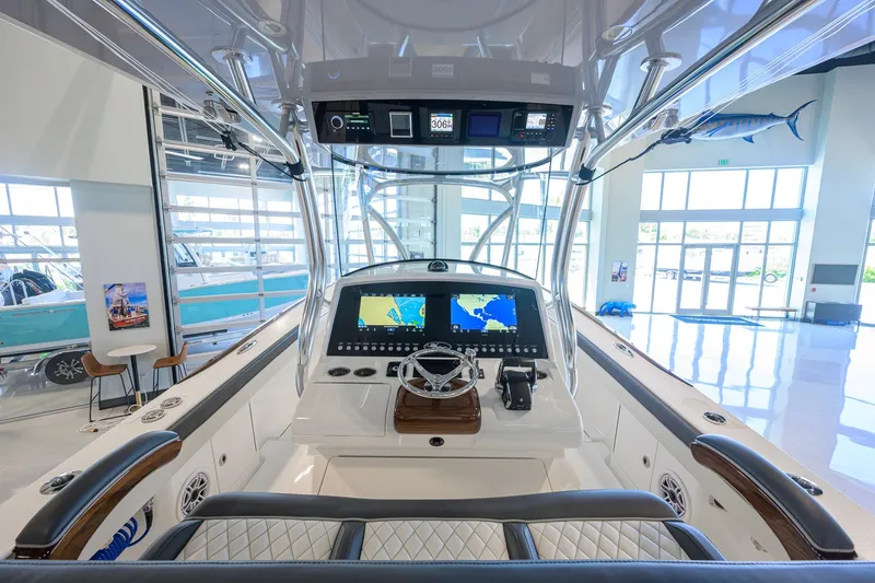 Slide: The Image of 2023 Valhalla Boatworks V-33 cockpit with advanced navigation system in showroom. - 11